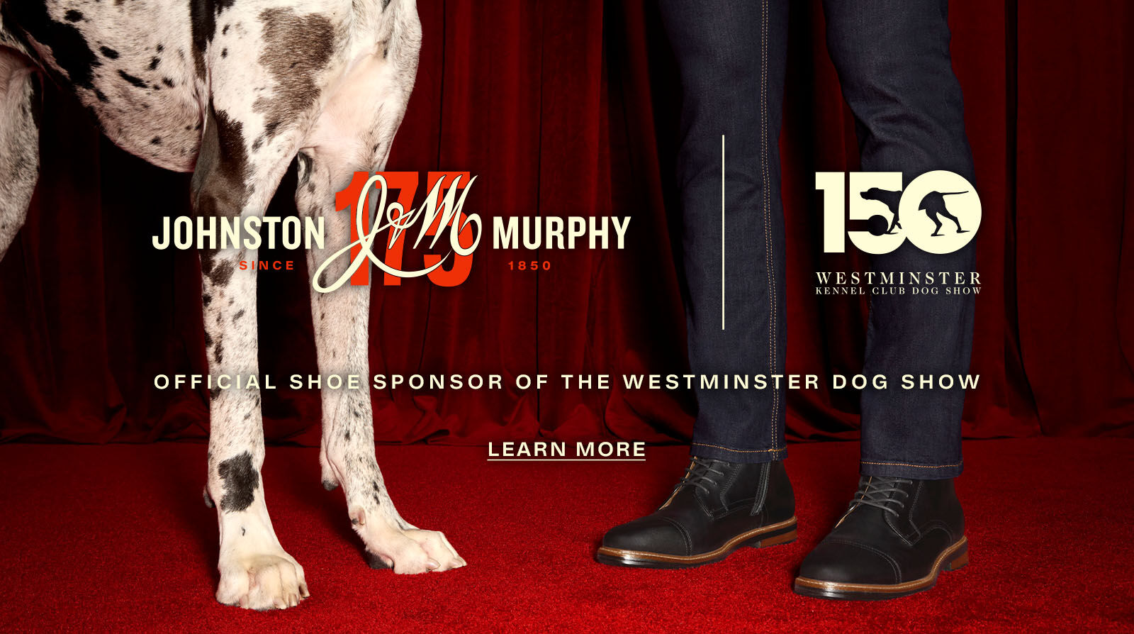 Lower half a white spotted Great Dane standing next to a man, which only shows his jeans and shoes. The banner states that Johnston & Murphy is the offical shoe sponsor of the Westminster Dog show.